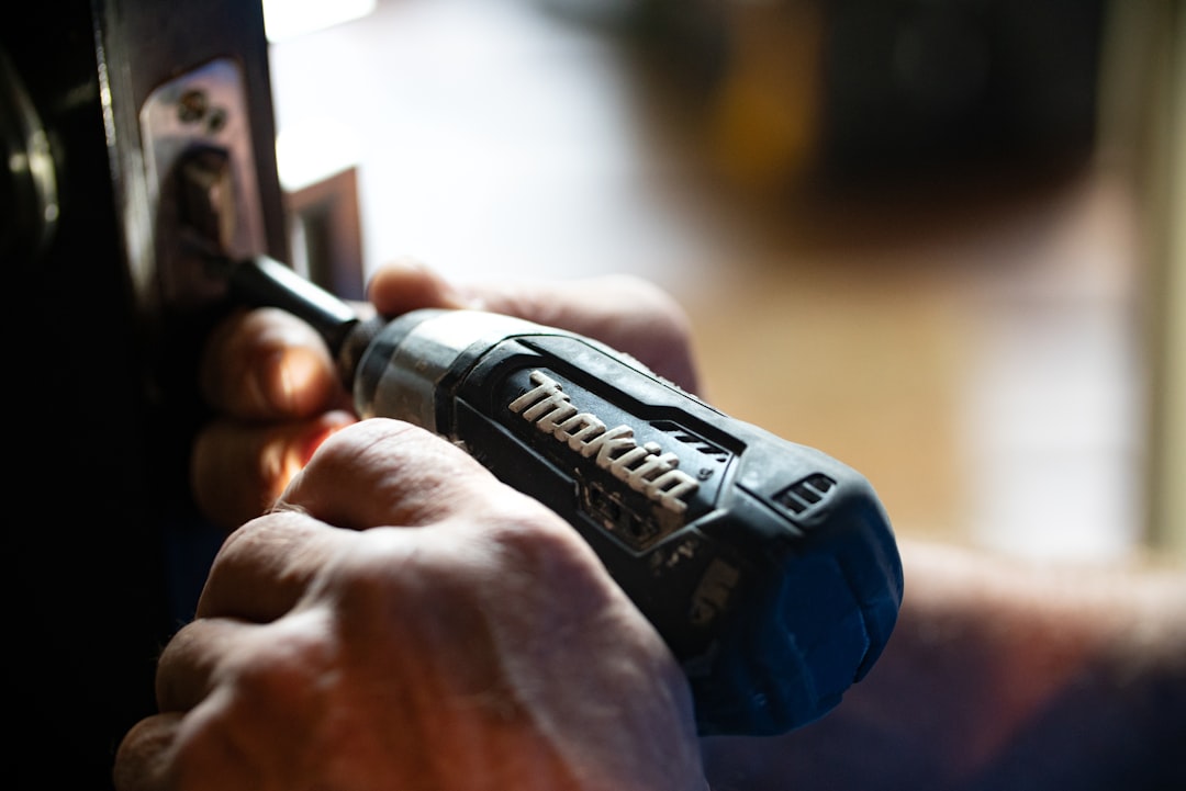 Technician diagnosing a kitchen appliance during an in-home repair call in Billings, Montana